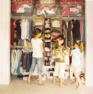 The closet organizer works to divide the space so each girl has a section 