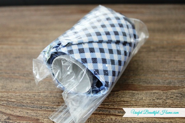 Place in a re-usable zip lock baggie to keep the tie from unrolling while traveling